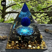 Prisma Calming Energy Pyramid 6CM on wooden surface with nature background.