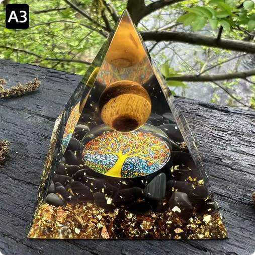 Prisma Calming Energy Pyramid 6CM on table, promoting relaxation and reducing stress, suitable for home or workspace.