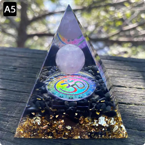 Prisma Calming Energy Pyramid 6CM with crystals on wooden surface.