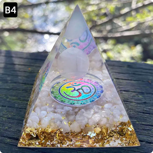 Prisma Calming Energy Pyramid 6CM with crystals on wooden surface.