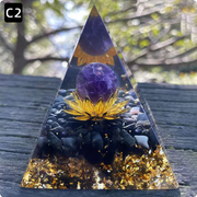 Prisma Calming Energy Pyramid 6CM with purple gemstone and gold accents, ideal for promoting tranquility and relaxation.