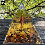 Prisma Calming Energy Pyramid 6CM on wooden surface, featuring crystals and natural elements for relaxation.