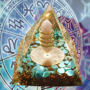Prisma Calming Energy Pyramid 6CM with crystals, designed for relaxation and stress reduction, against astrological background.
